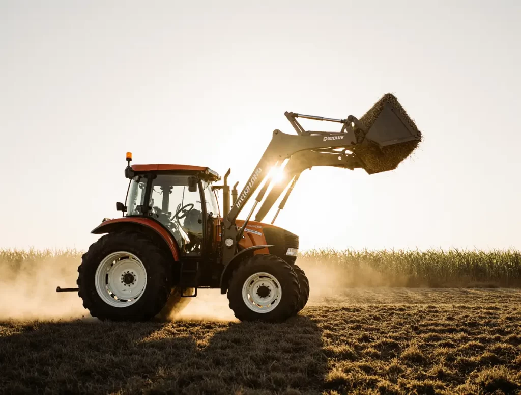 A close-up view of a tractor's hydraulic system with detailed hoses and valves, highlighting the importance of high-quality hydraulic tractor parts for reliable performance.